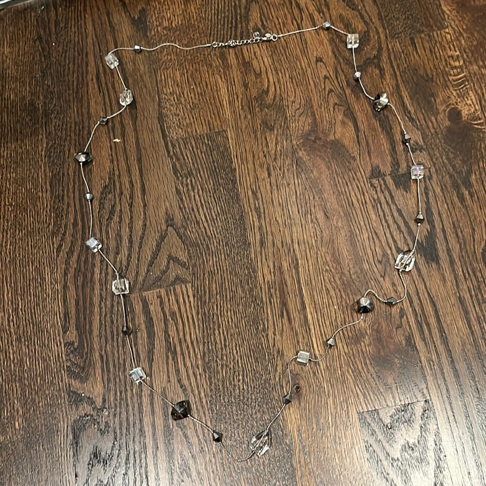 Long silver necklace with clear and charcoal bead detailing!
